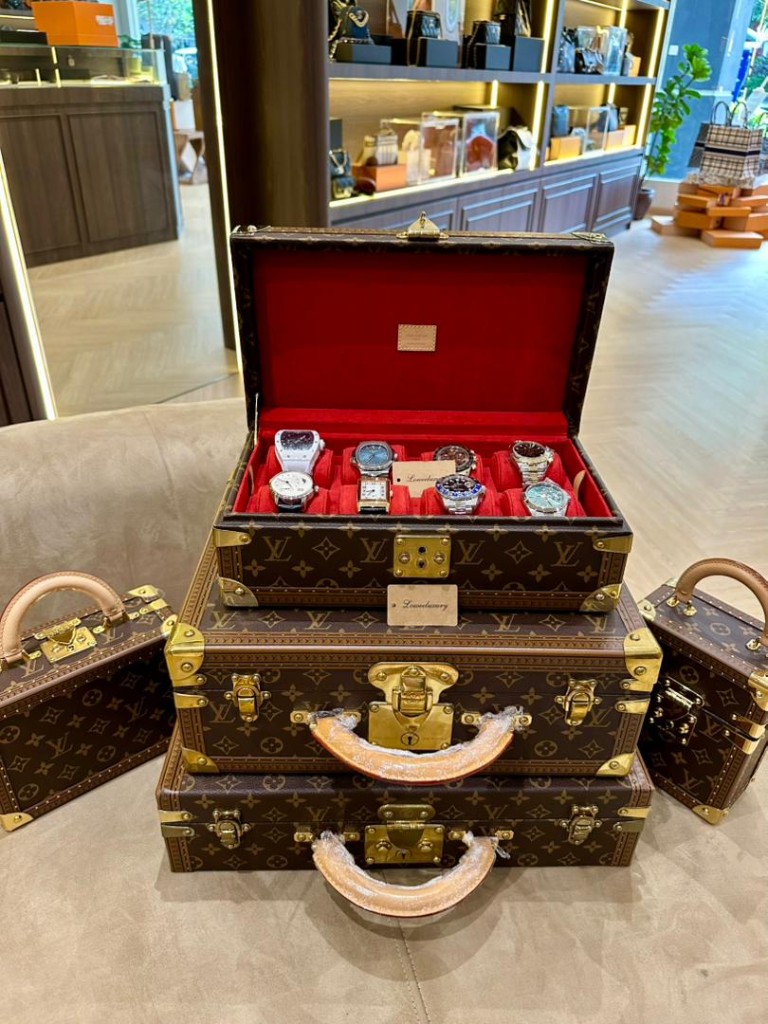 Louis Vuitton monogram trunks with luxury watch case display