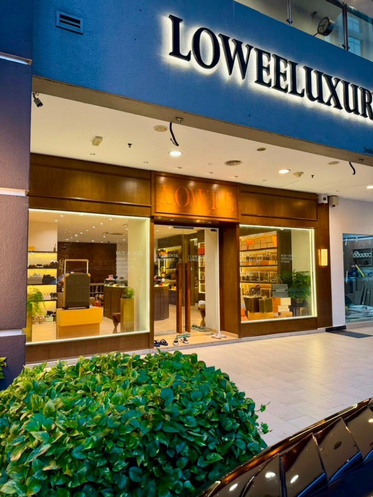 LOWEELUXURY boutique storefront with illuminated signage and main entrance at Publika KL